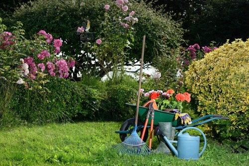 A professional clearing garden debris in Shoreditch